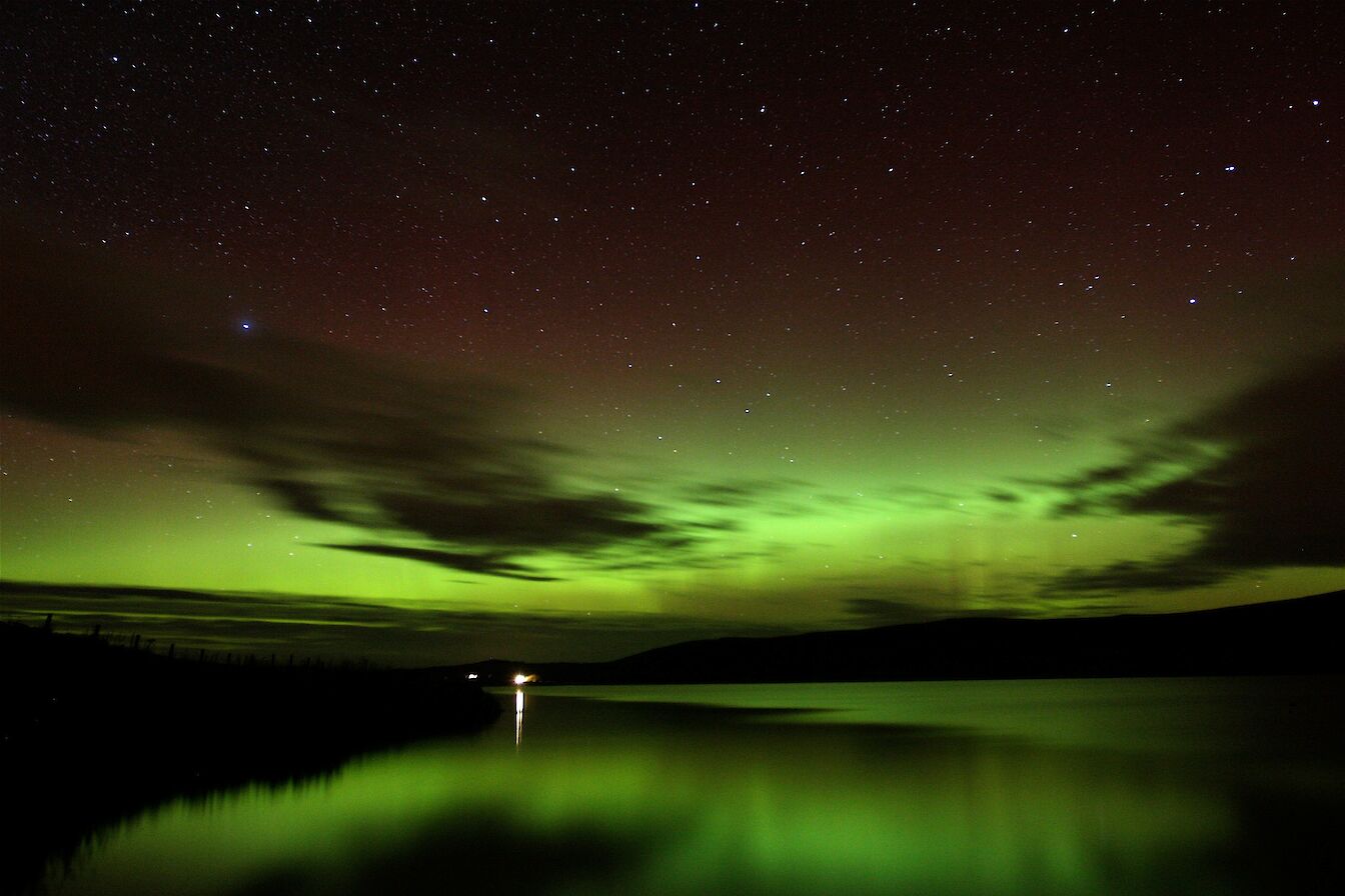 Merry dancers over Kirbister Loch, Orkney - image by John Wishart