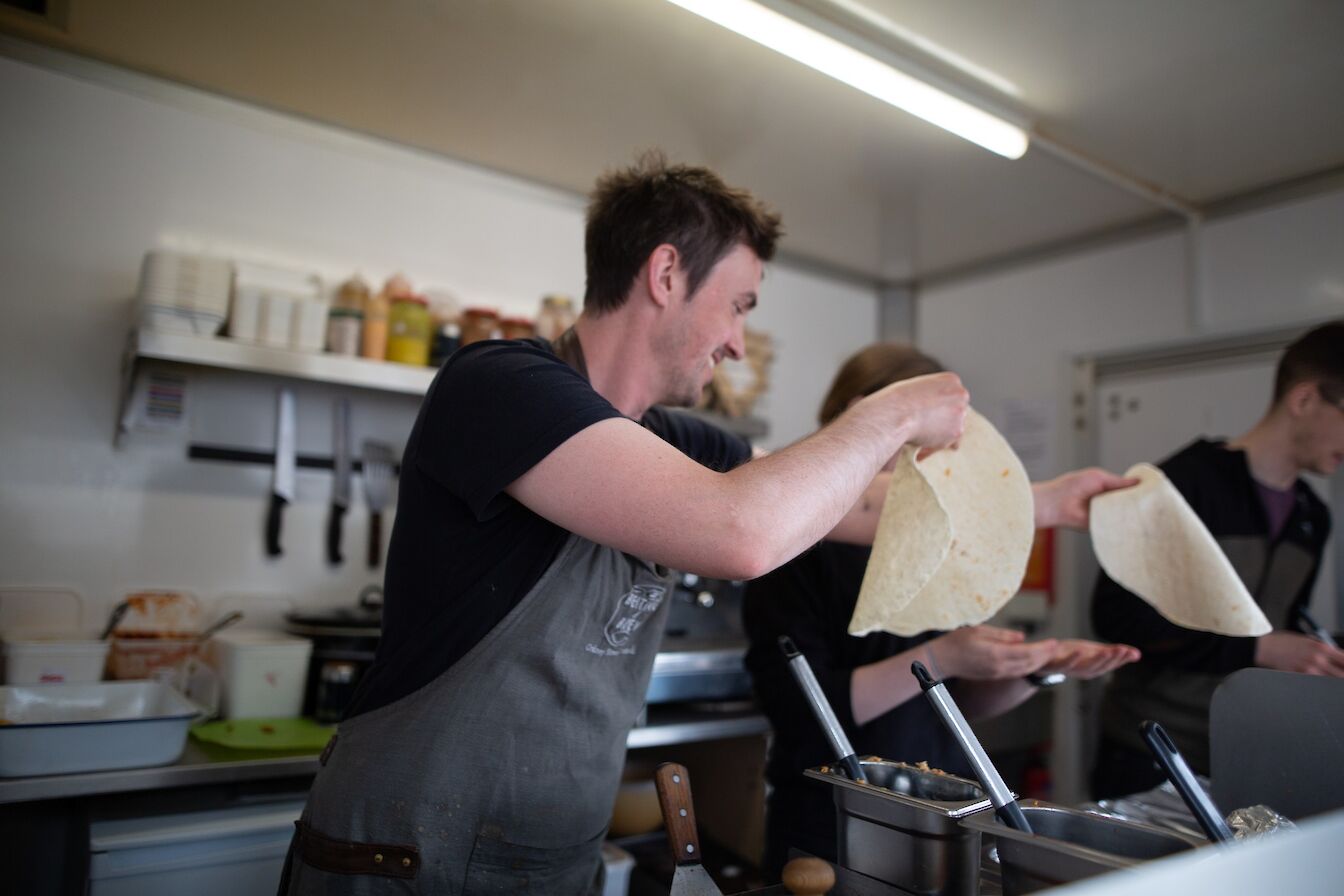 The Beiting & Brew team creating their street food dishes in the trailer