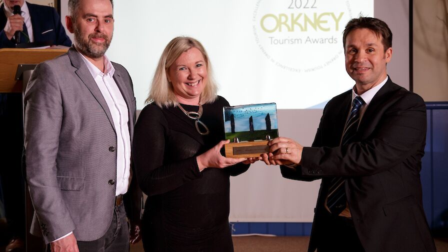 The team from Saintear, winners of the Best Newcomer to Tourism award, collecting their trophy from NorthLink Ferries' Magnus Dixon