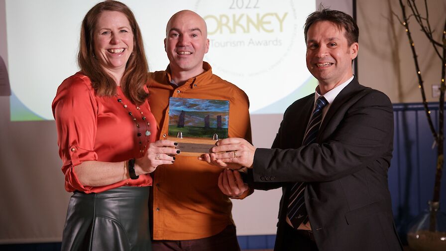 The JP Orkney team, collecting their Responsible Tourism award from NorthLink Ferries' Magnus Dixon