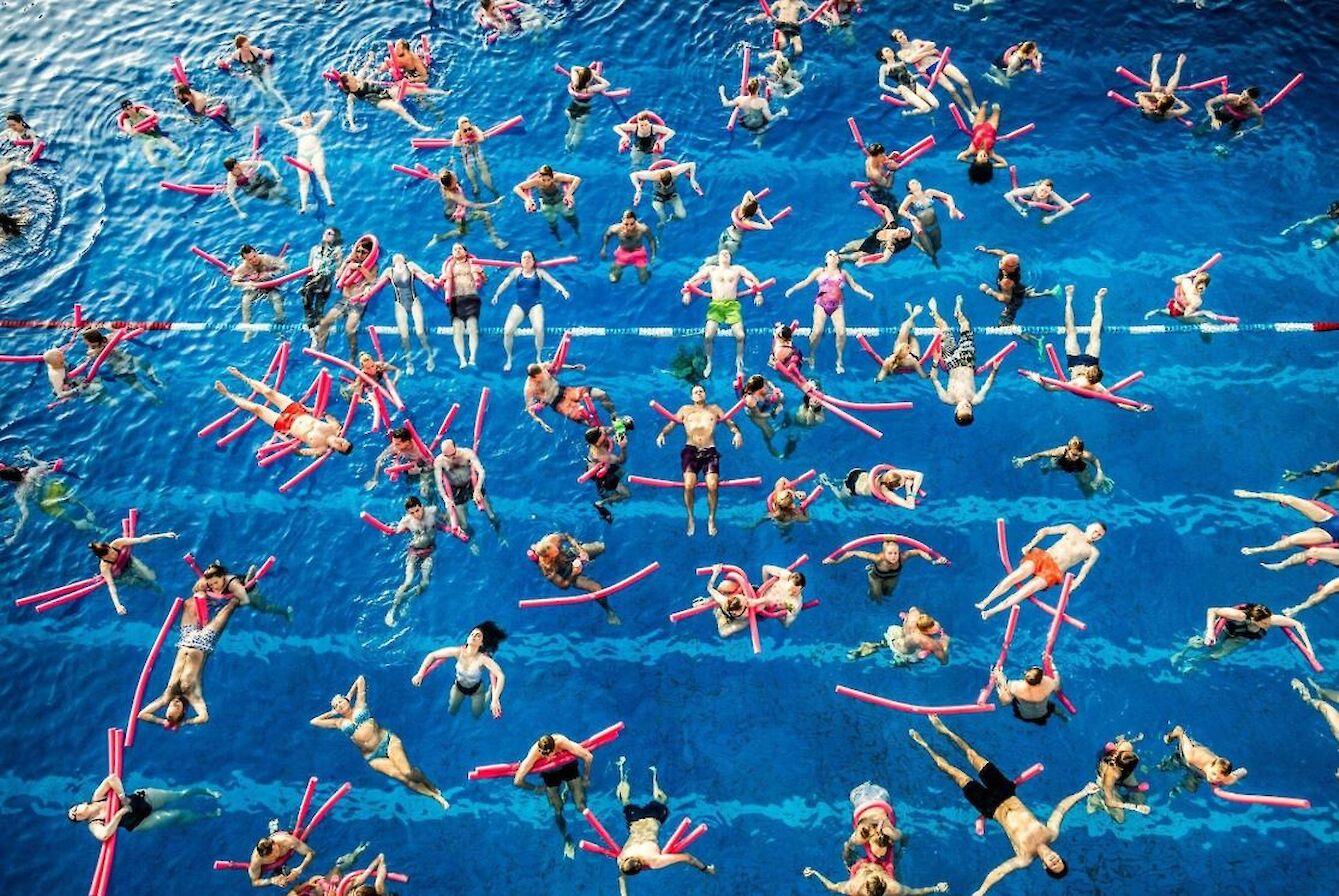 Audience in the water at a Swimming with Gravitational Waves event