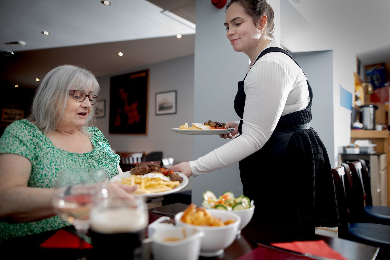 Customers at the Stronsay Hotel, Orkney